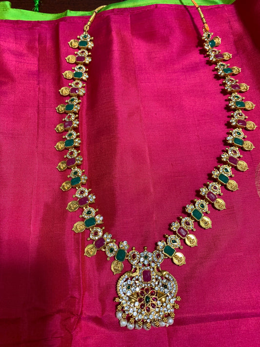 Pink and green stone studded golden necklace
