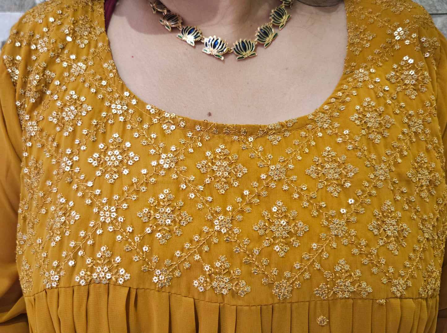 Front pleated mustard yellow gown with embroidery and sequence work