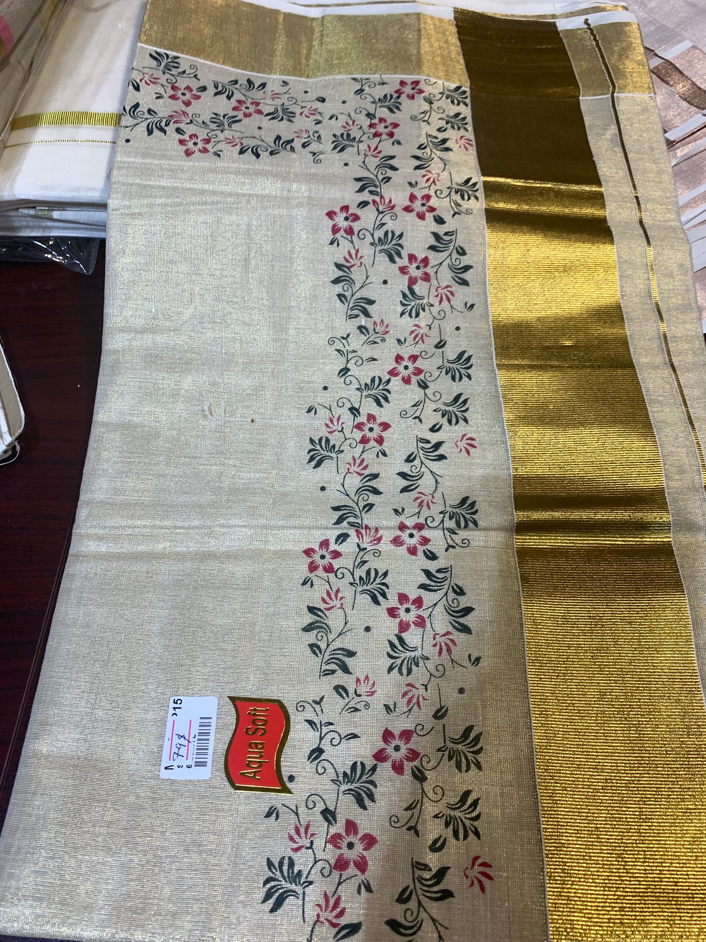 Kerala golden tissue saree with floral print