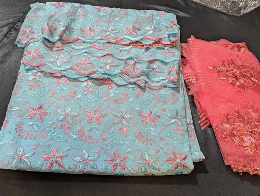 Georgette saree in sky blue colour with dark peach embroidery band scalloped work in borders