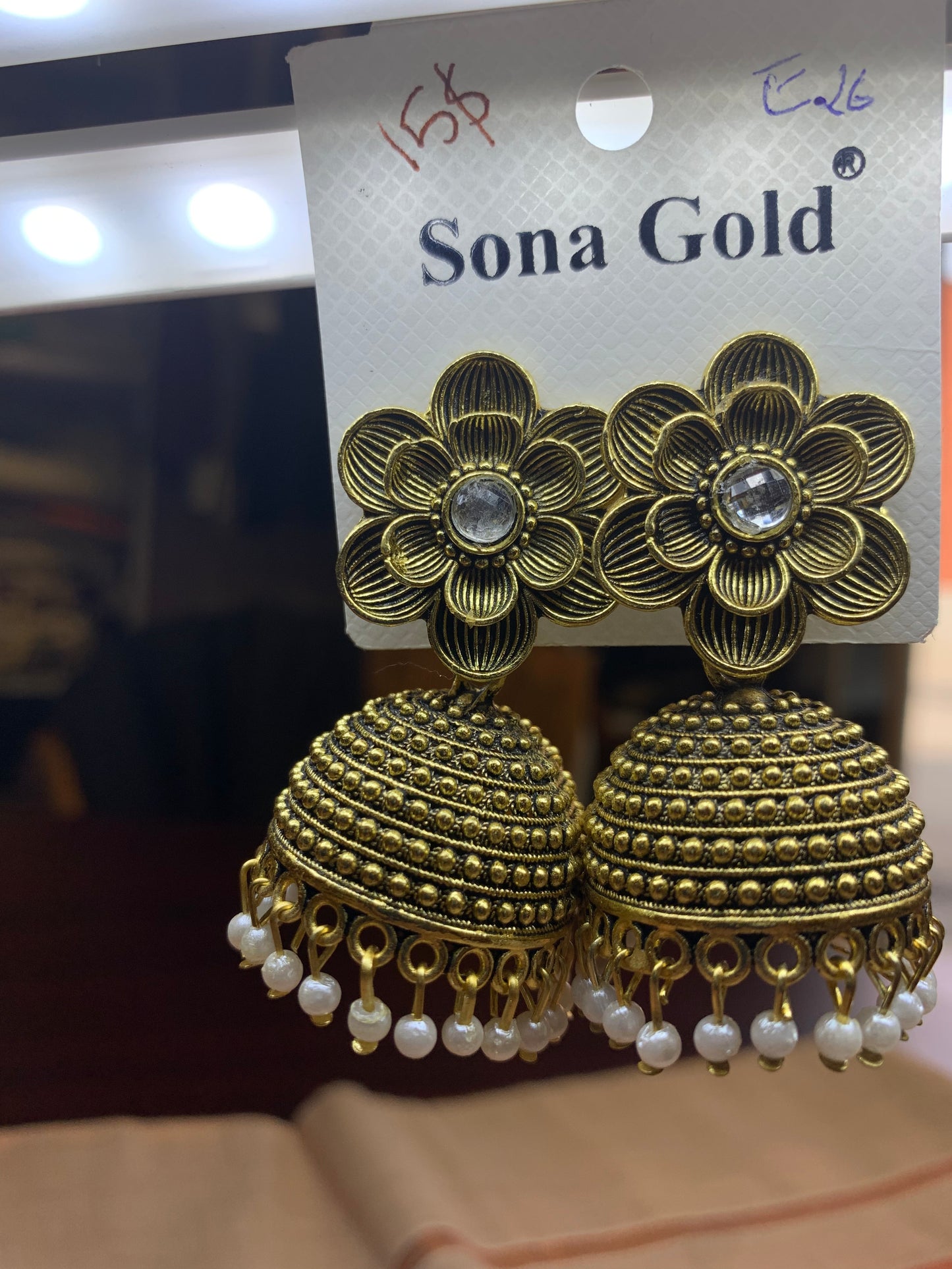 Gold copper floral jhumka earring