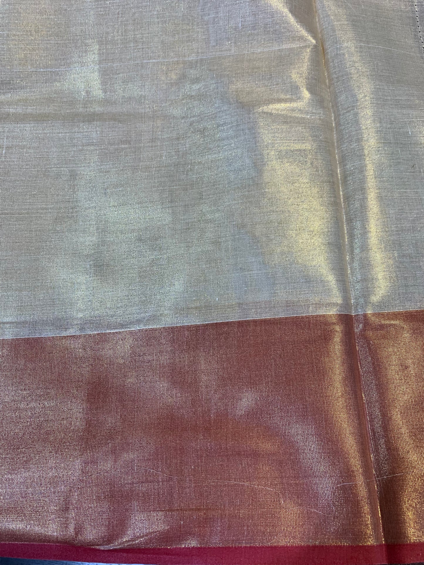 Golden tissue saree with light red  border