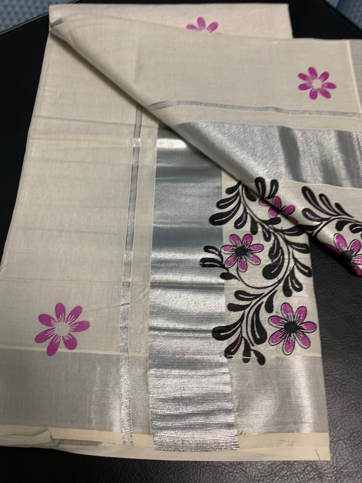 Kerala silver tissue saree with silver border and pink floral print