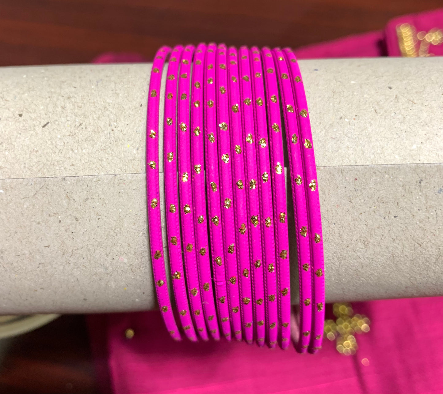 Pink metal bangles with gold spot design