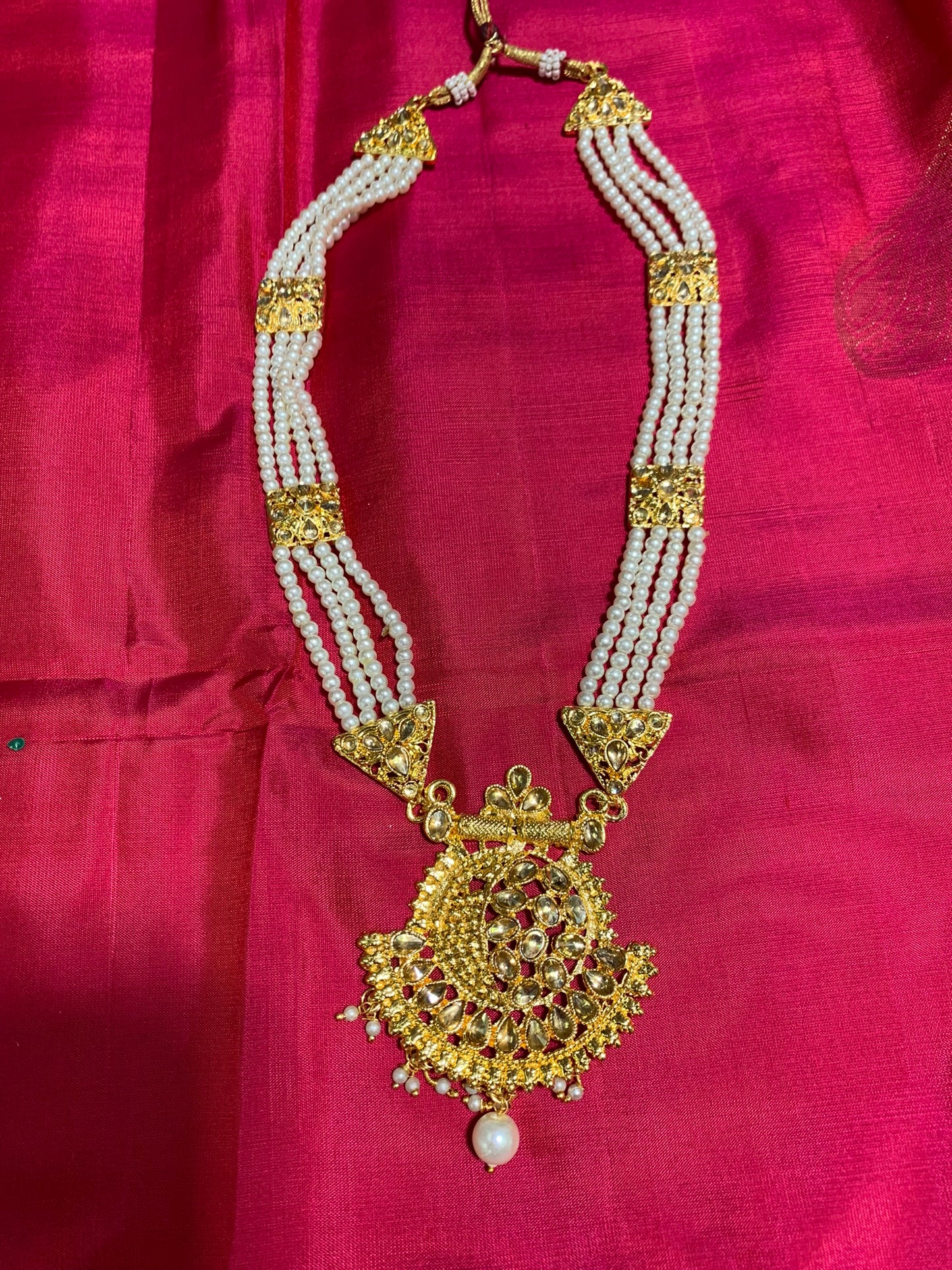 White pearl long necklace with golden pendant