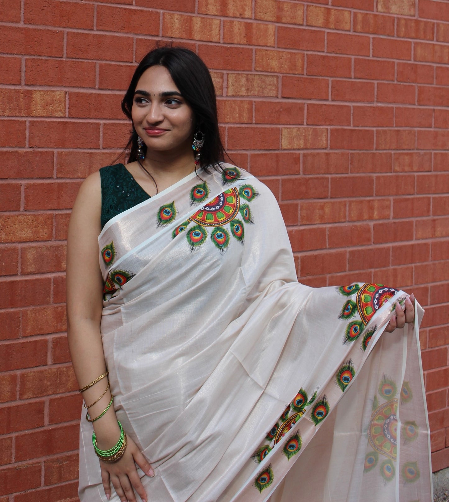 Kerala rose gold tissue saree with peacock feather design