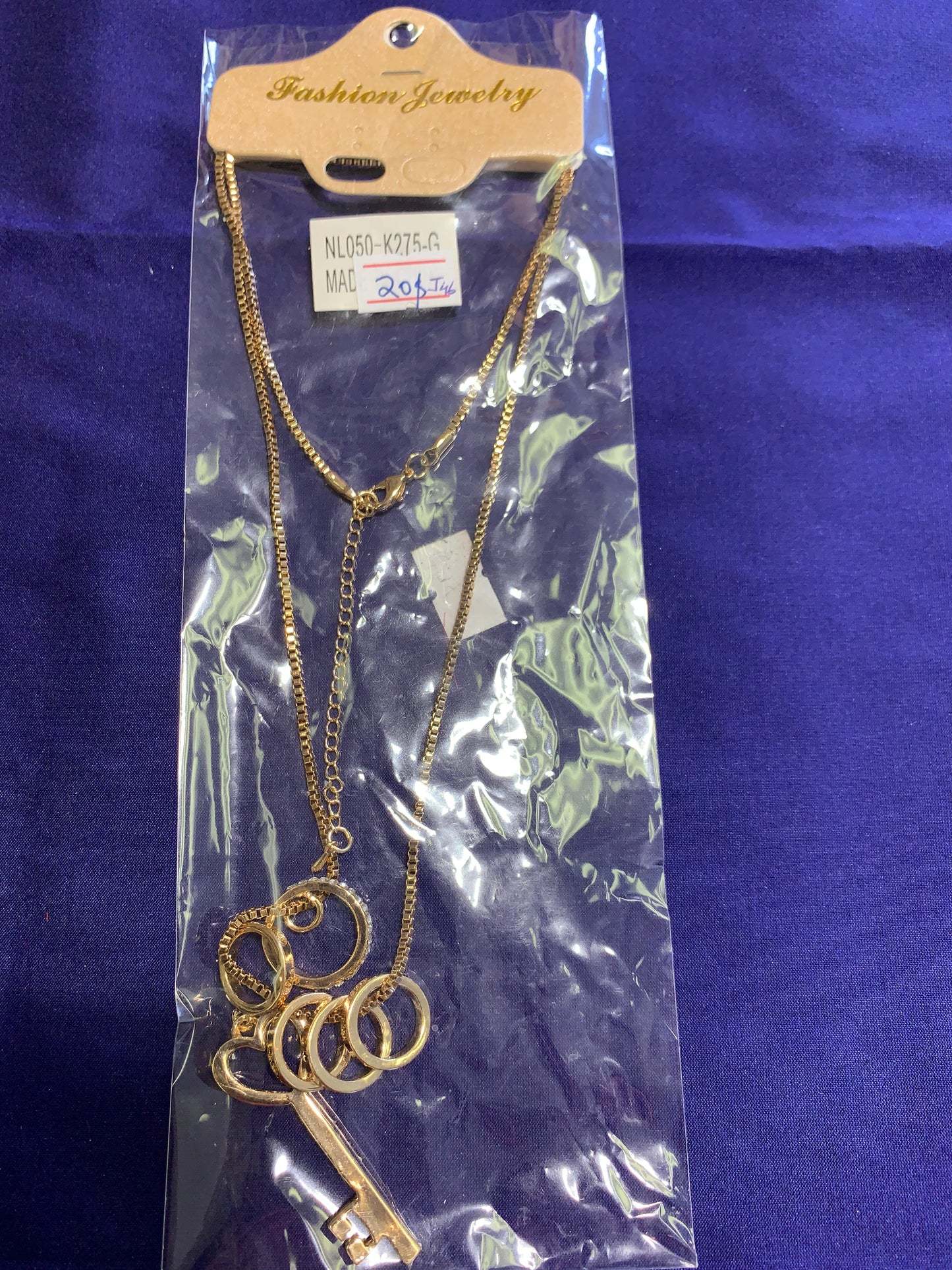 Gold chain (key and rings pendent)