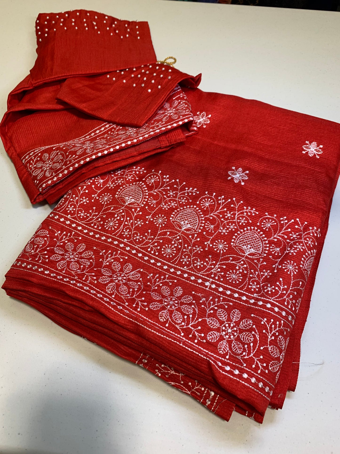 Red Kota silk saree white chikankari design-stitched blouse with white pearls