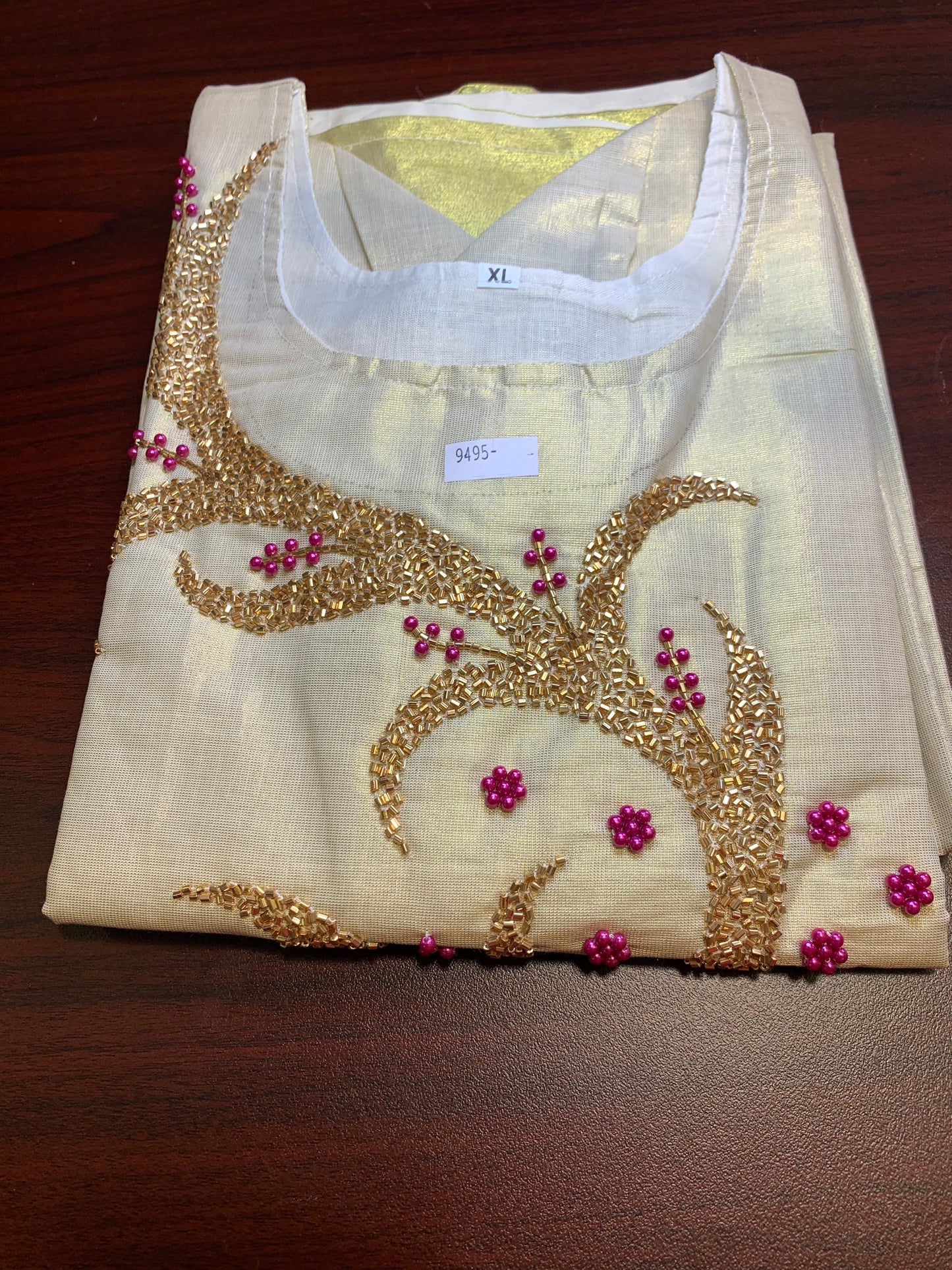 Golden tissue kurthi beautifully crafted with rose gold and pink beads