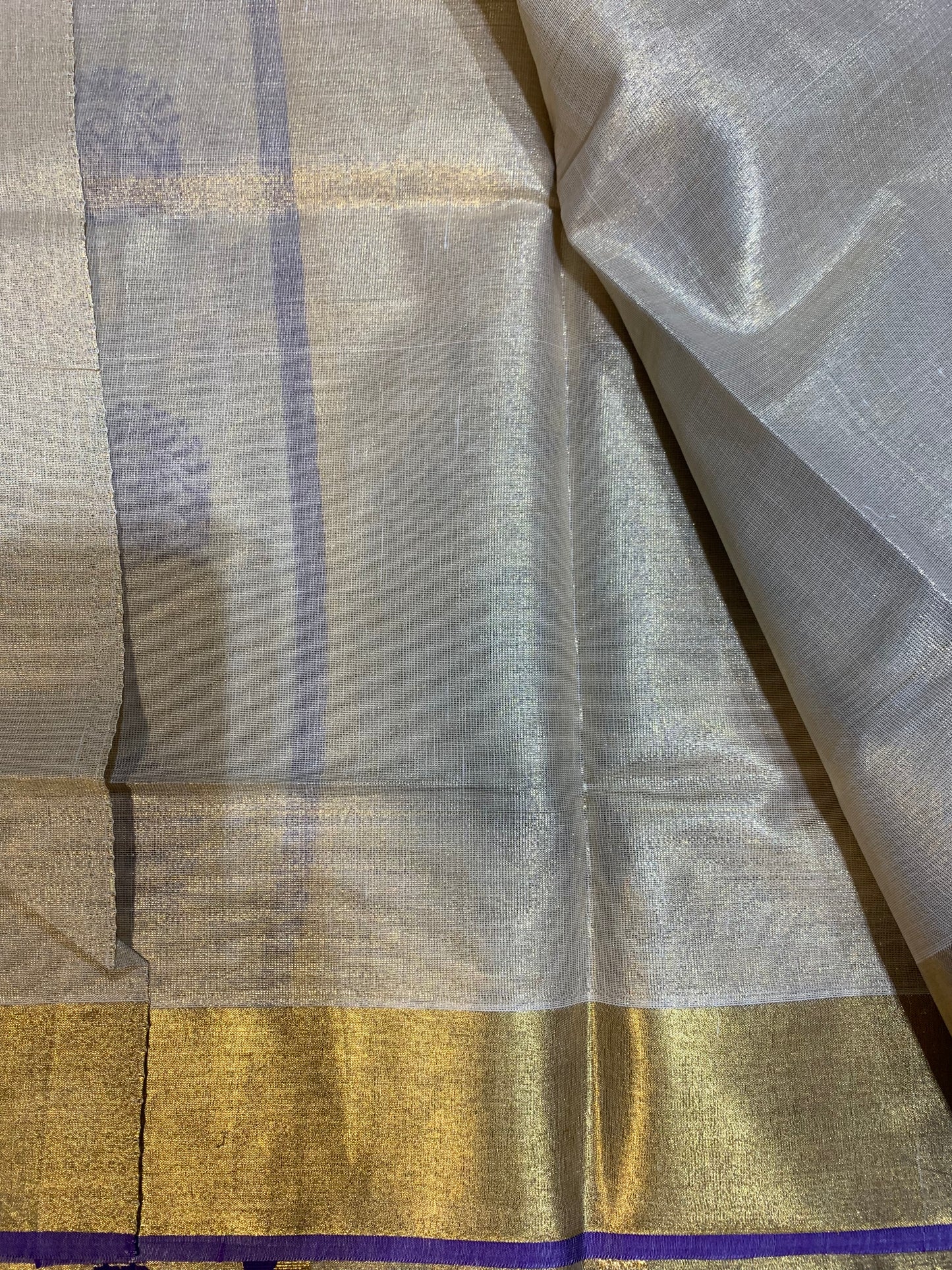 Golden tissue saree with purple border