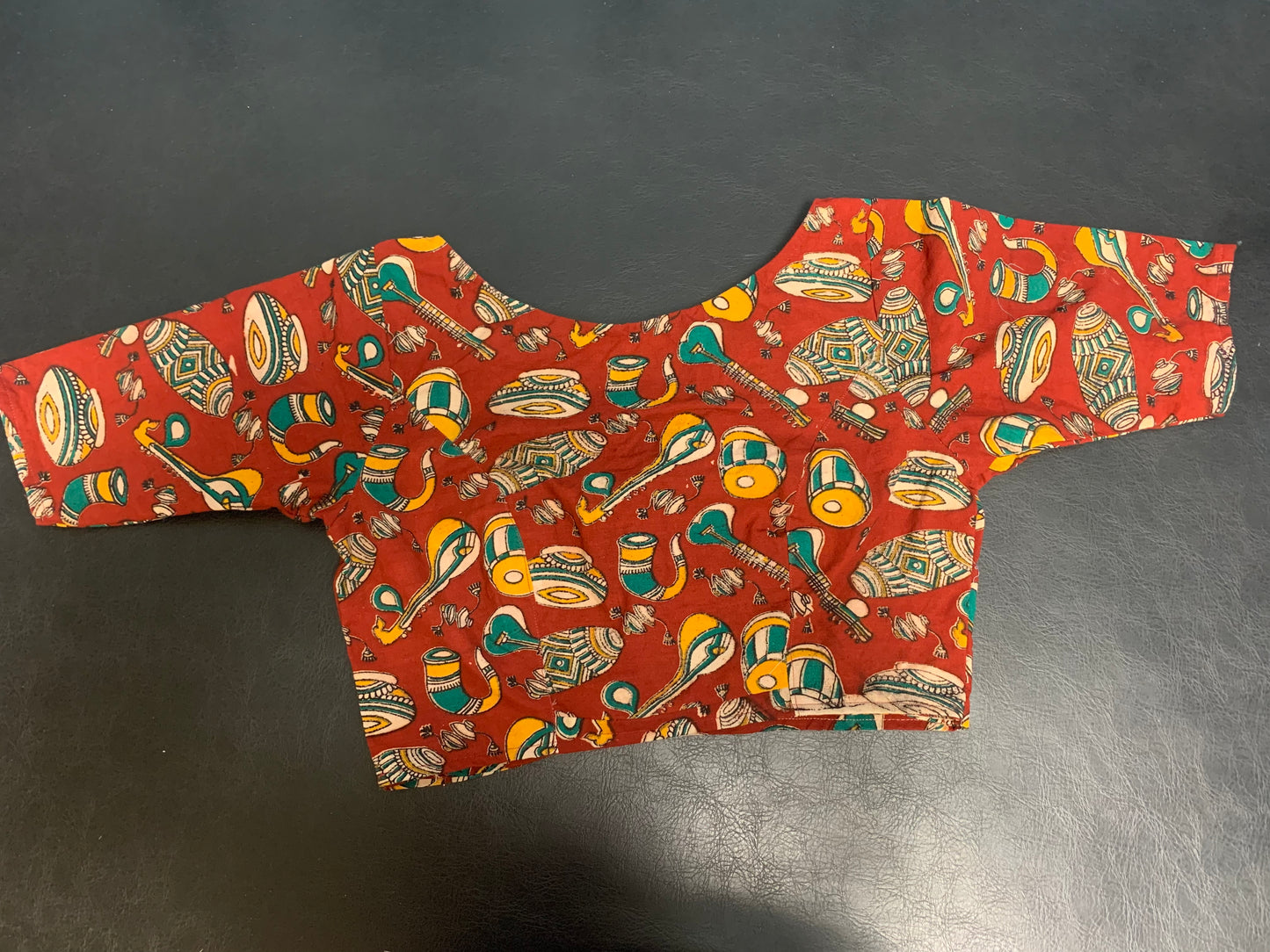 Red blouse with printed design