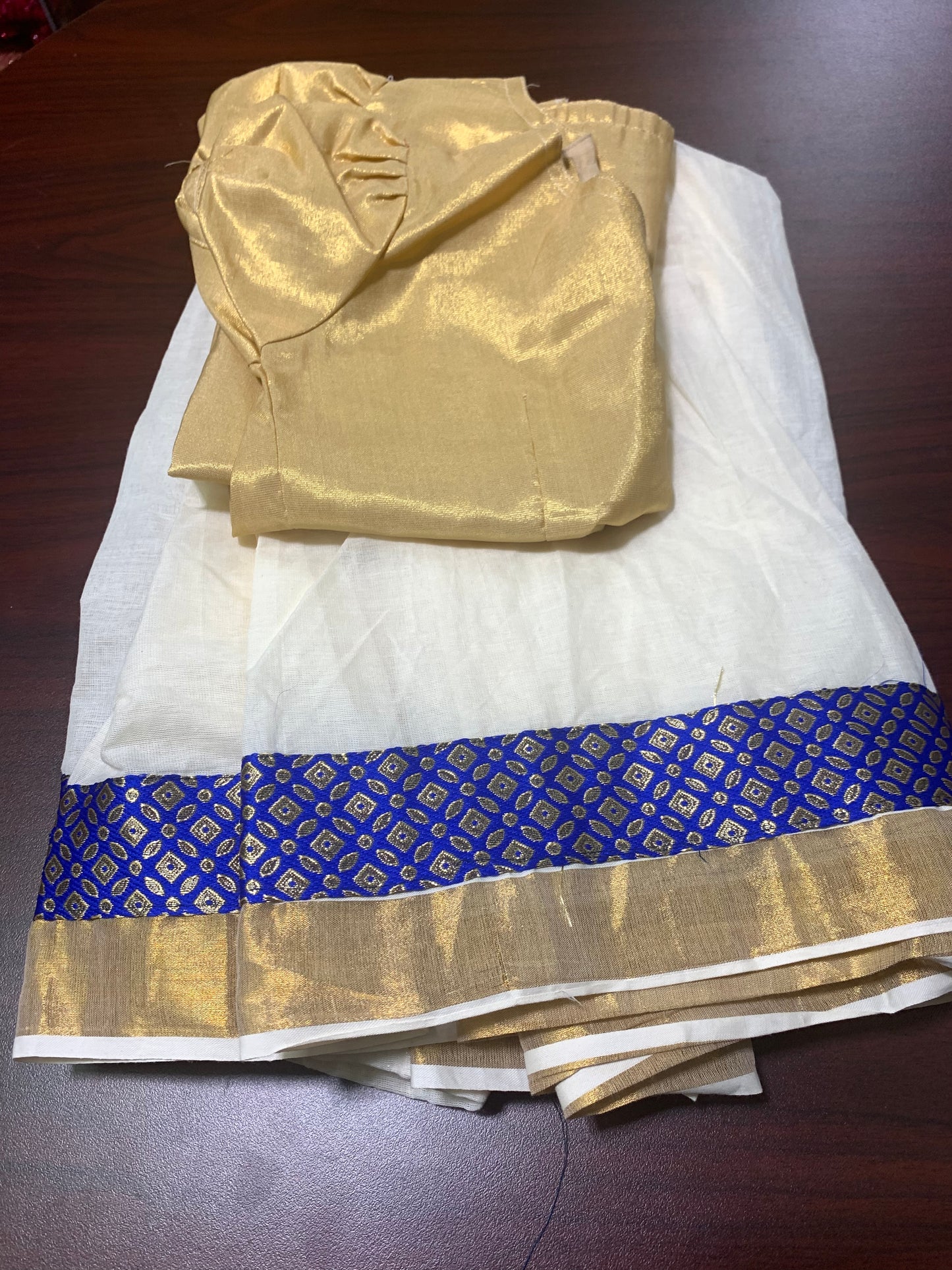 Kerala cotton kasavu skirt with blue brocade border and golden tissue top