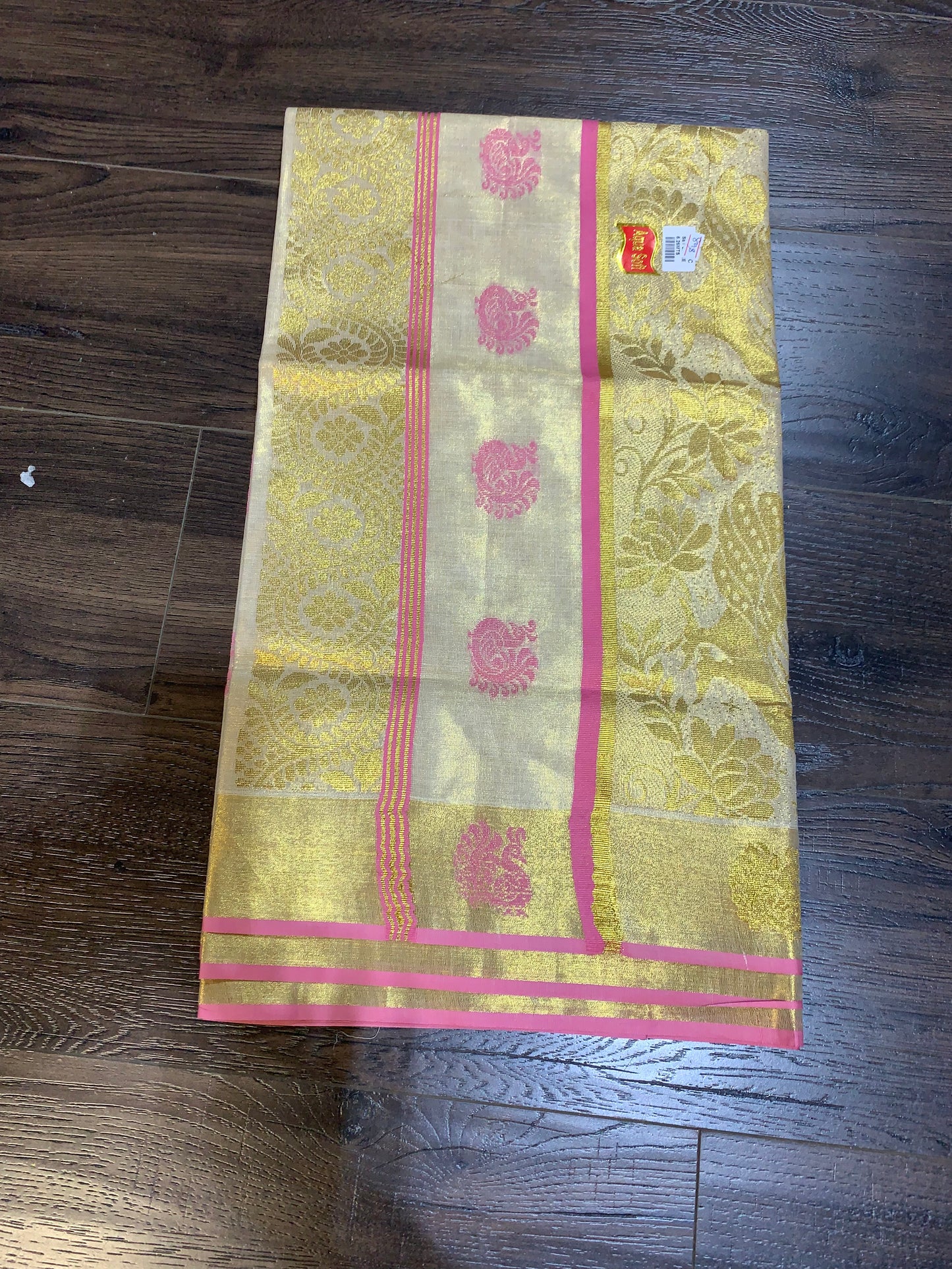 Kerala golden tissue saree with pink border