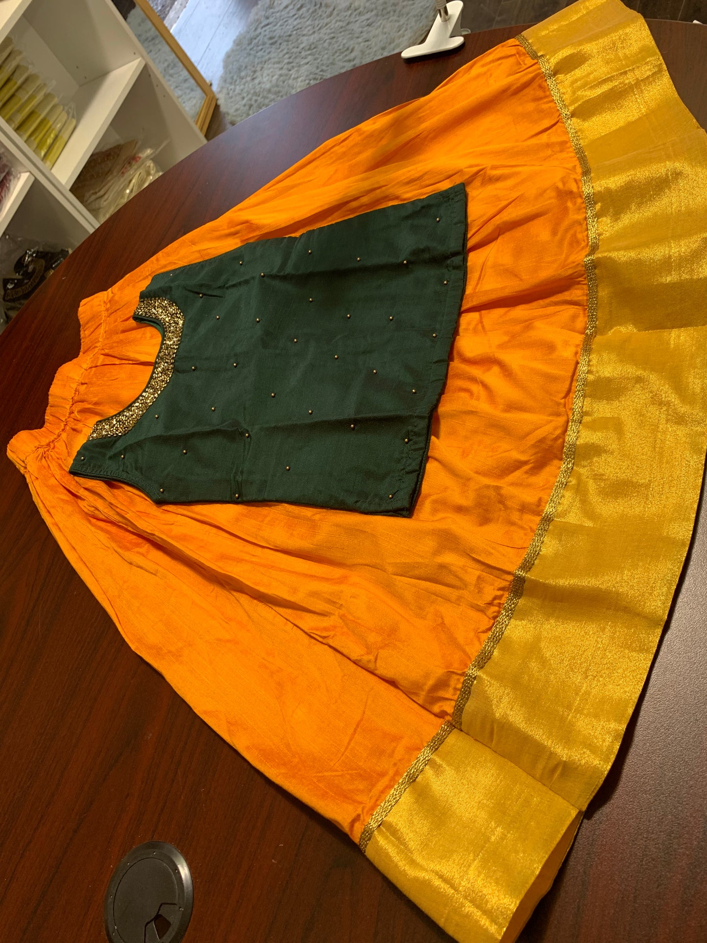 Silk skirt with golden border and dark green beads worked top