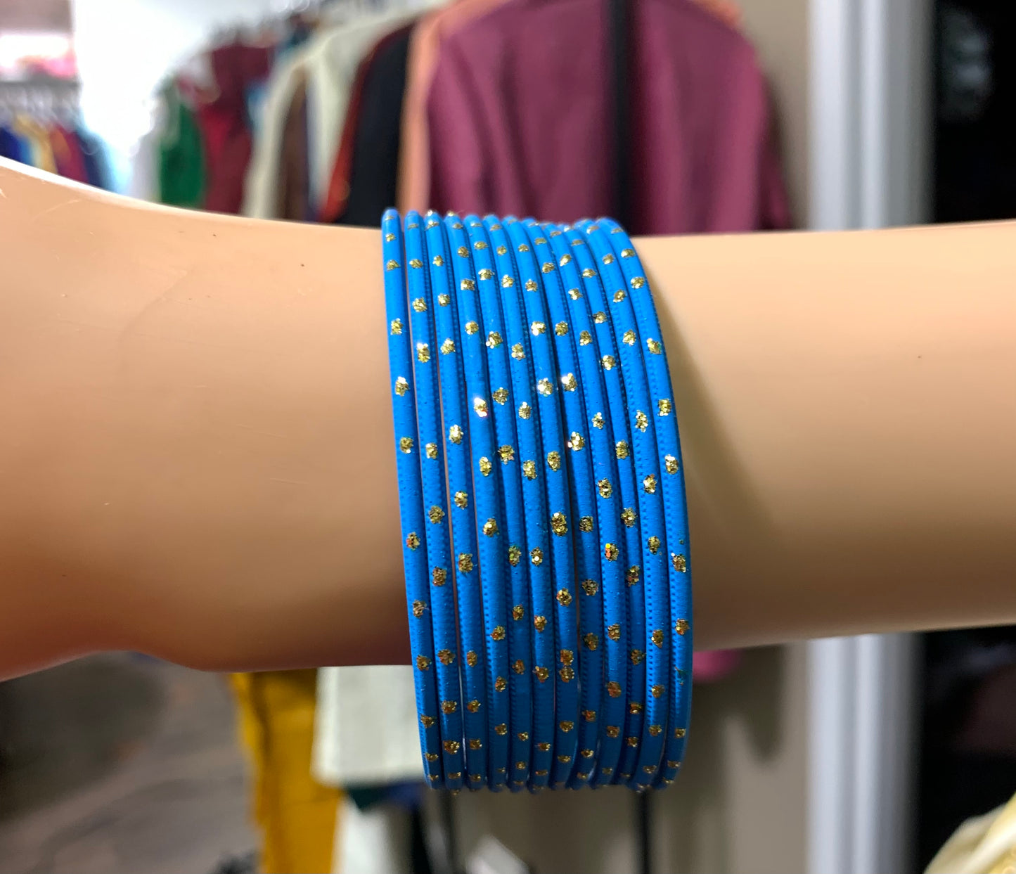 Blue metal bangles with gold spot design