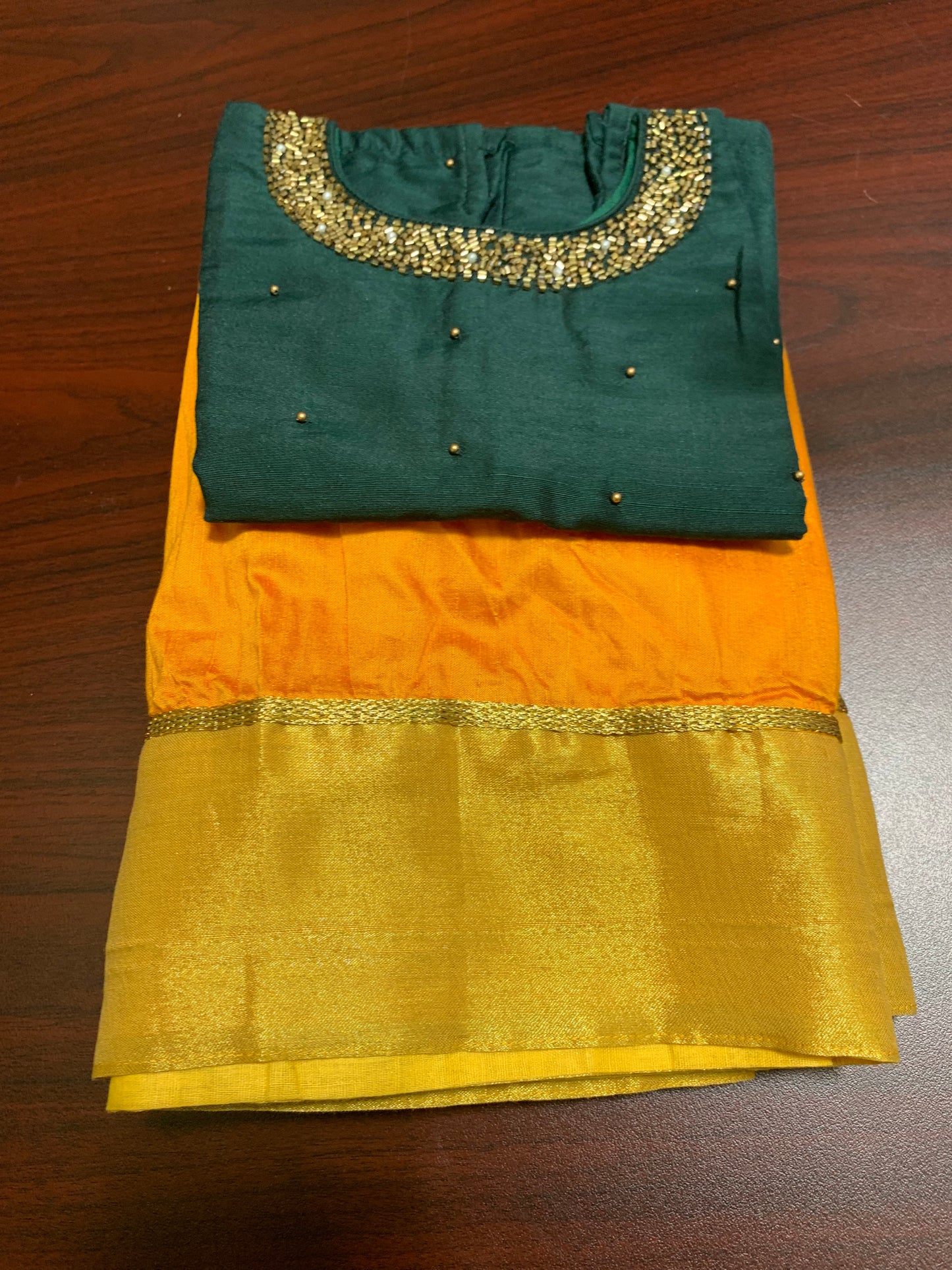 Silk skirt with golden border and dark green beads worked top