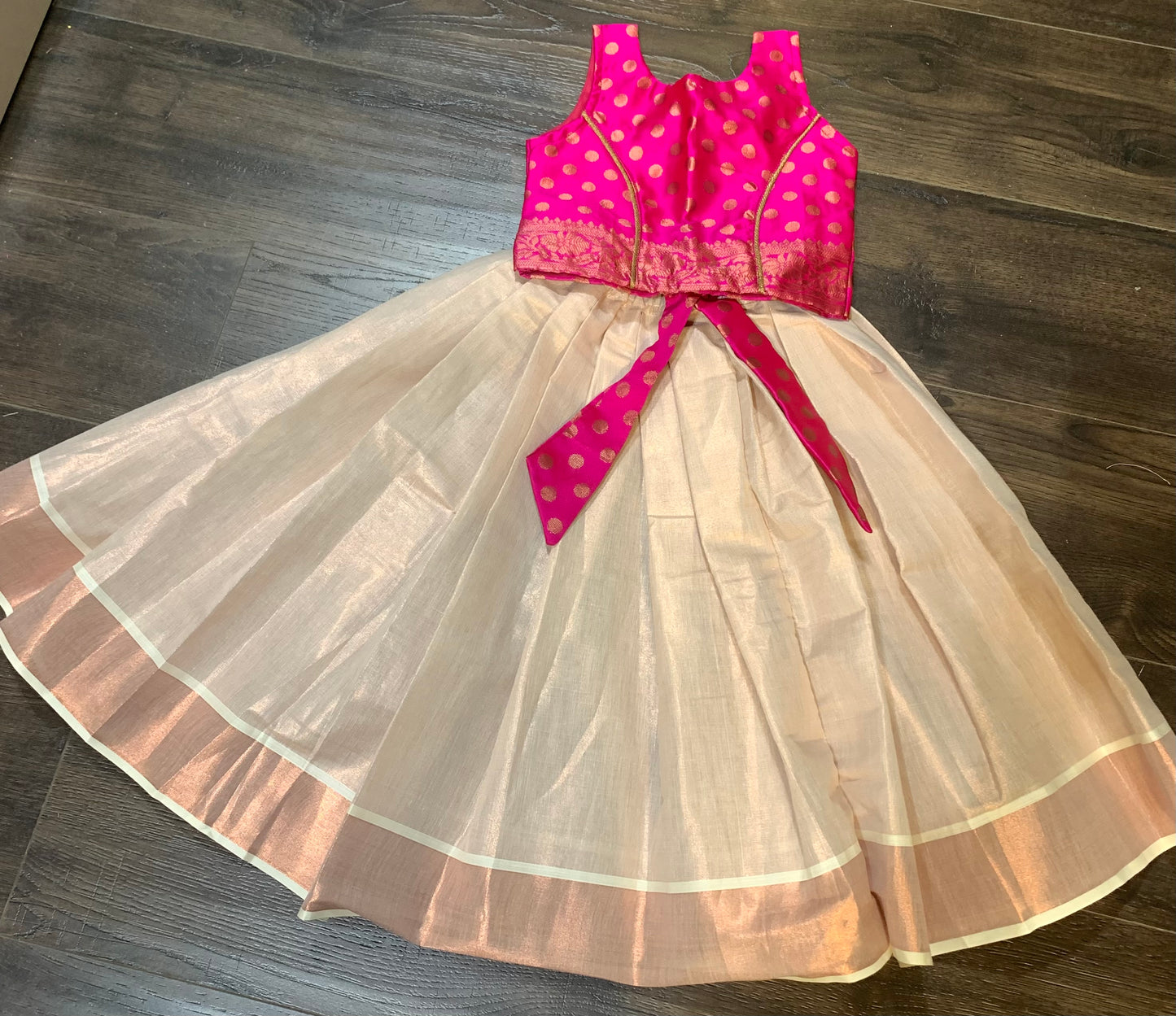 Rose gold Kerala kasavu border skirt with magenta silk brocade blouse