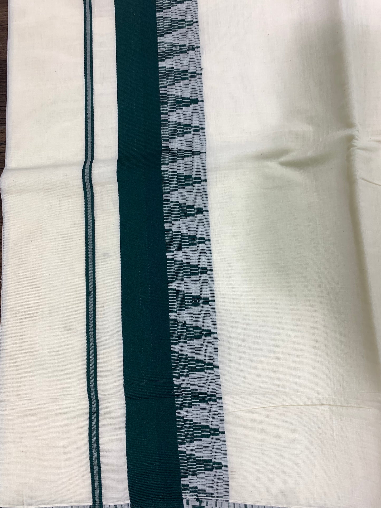 Kerala cotton settu saree with dark green border.