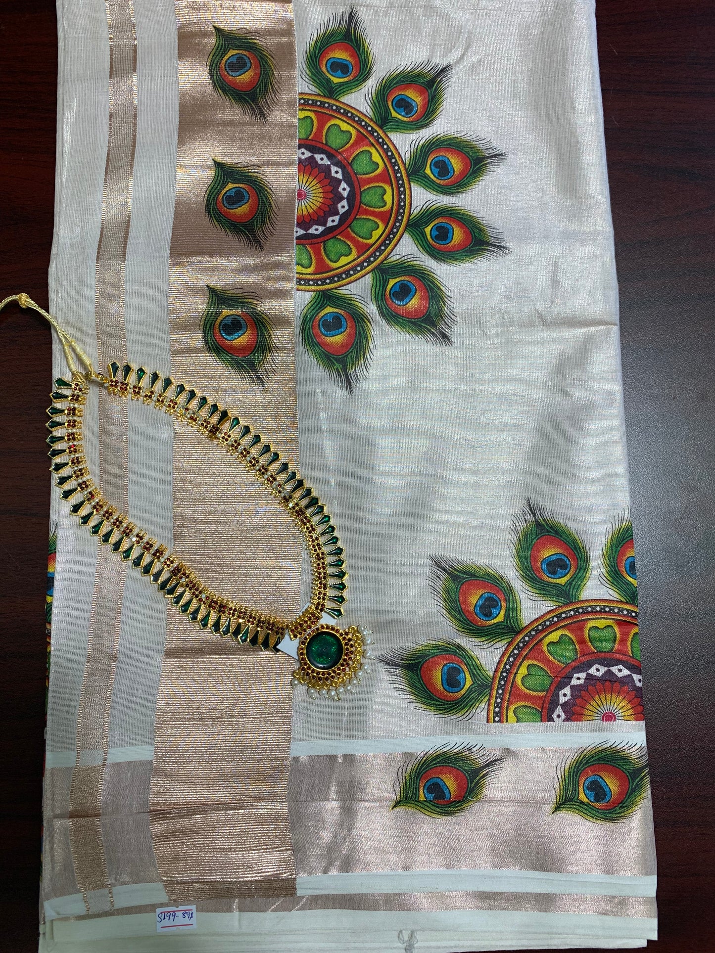 Kerala rose gold tissue saree with peacock feather design