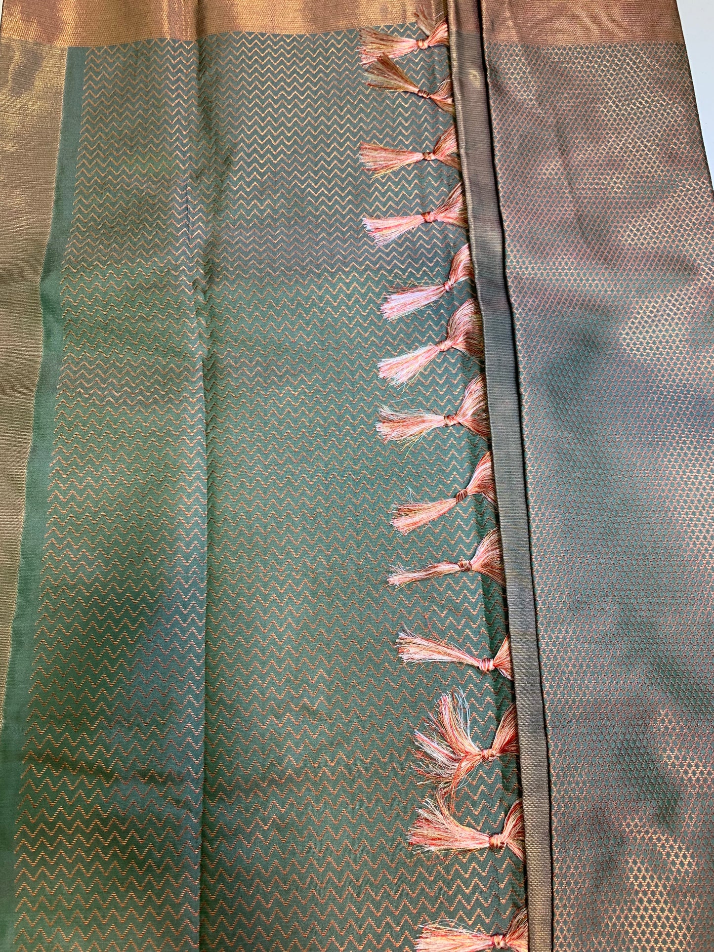 Olive green copper zari border art silk saree(unstitched blouse)