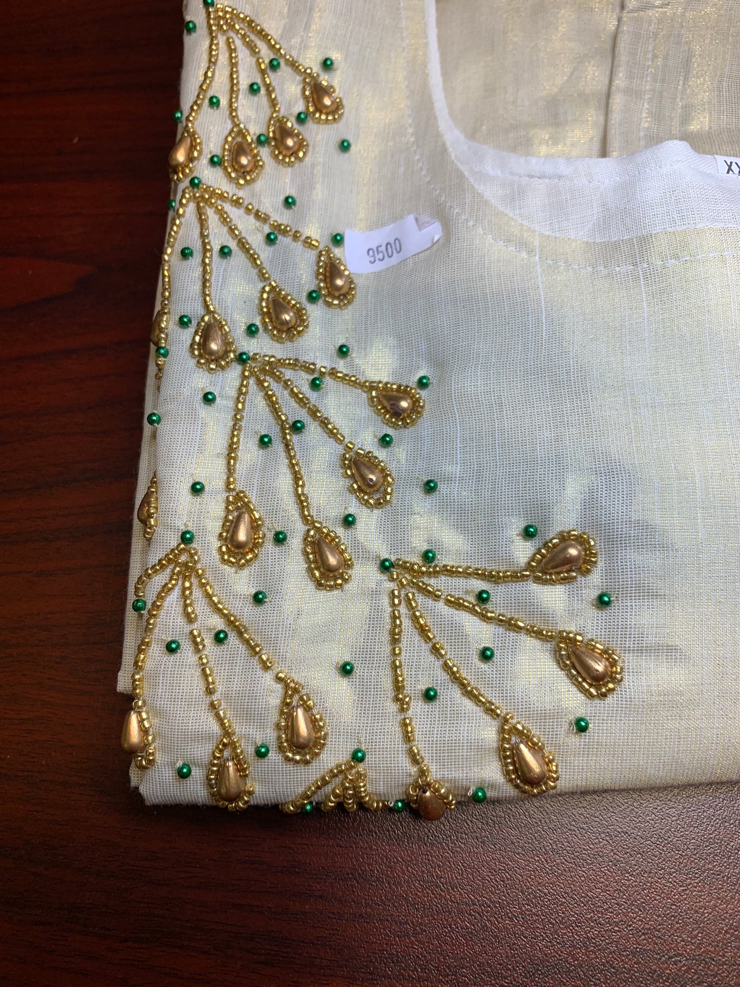 Golden tissue kurti with beads work