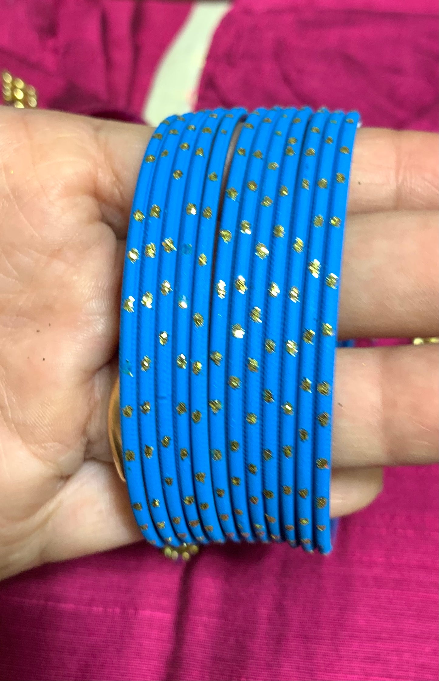 Blue metal bangles with gold spot design