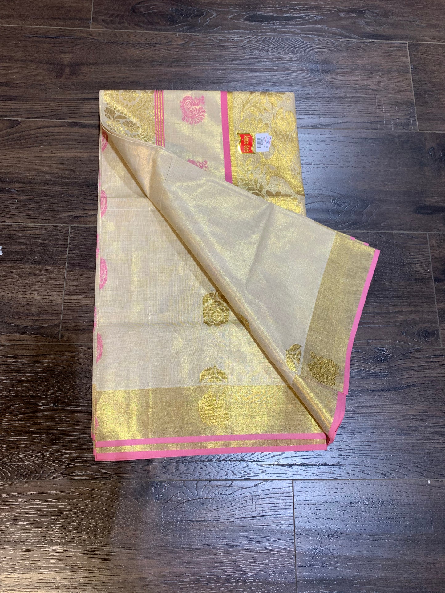 Kerala golden tissue saree with pink border