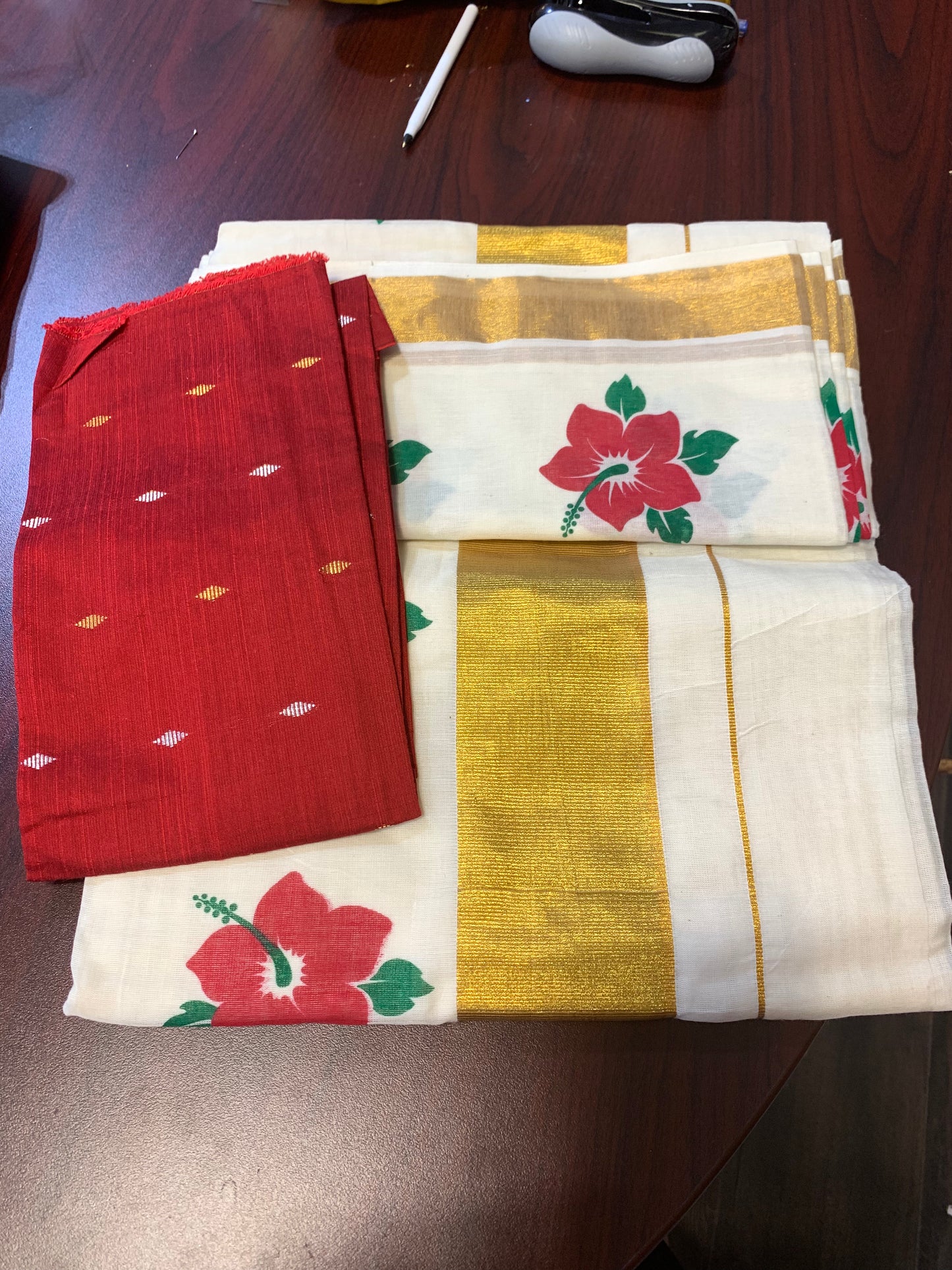 Kerala settu saree with floral  printed design and matching cotton silk blouse