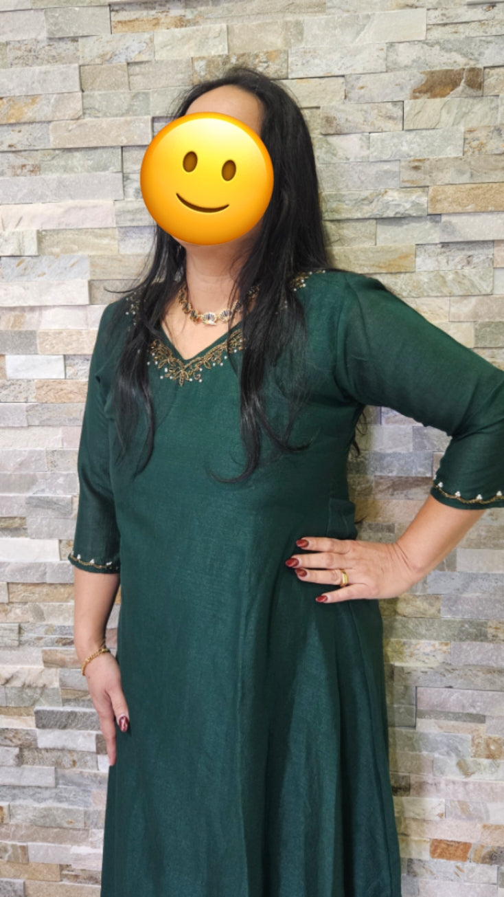 A line kurti in vichitra silk-bottle green with neck and sleeve hand work