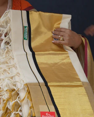 Kerala settu saree with wide golden pallu